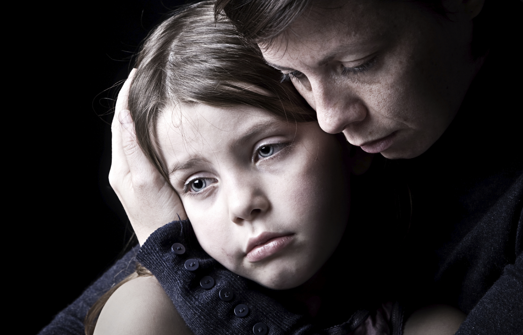 Powerful Low Key Shot of a Mother Consoling her Daughter