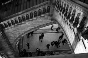 greyscale photo of court house interior with large staircase