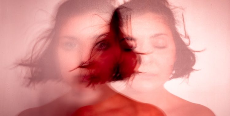 One woman in faded red, appearing twice: eyes open and eyes closed.