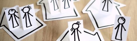 Paper cutouts of stick figure family separated into different groups