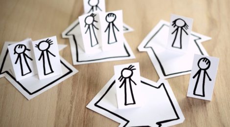 Paper cutouts of stick figure family separated into different groups