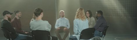 Group of people sitting together in a therapy setting