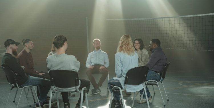 Group of people sitting together in a therapy setting